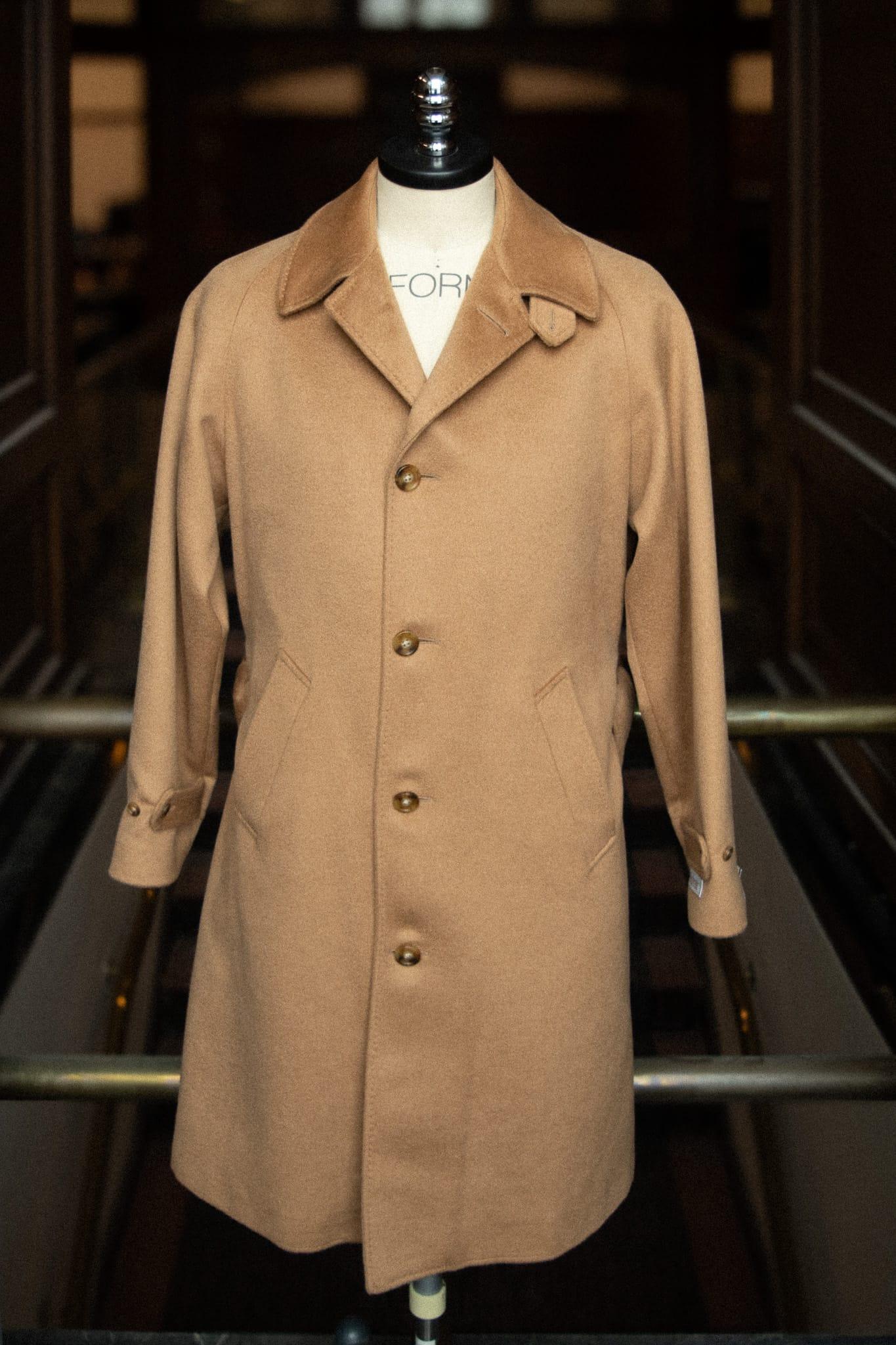 Balmacaan overcoat in baby camel hair on a tailor’s bust form